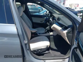 2021 BMW X1 sDrive28i z VIN WBXJG7C02M5T37169, wystawiony jako IAAI lot #42226396 z przebiegiem 48 603 mil mil oraz . Historia ofert i sprzedaży dostępna na DreamBid. Obrazek 5.