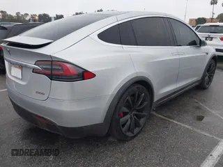 2016 Tesla Model X P90D with VIN 5YJXCBE41GF006284, listed as a IAAI auction lot 41809683 with 71,135 mi miles. Bid and sale history available at carsss.com. Image 4.