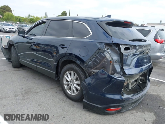 2016 Mazda CX-9 Sport with VIN JM3TCABY3G0123239, listed as a IAAI auction lot 42570700 with 119,414 mi miles and . Bid and sale history available at DreamBid. Image 3.