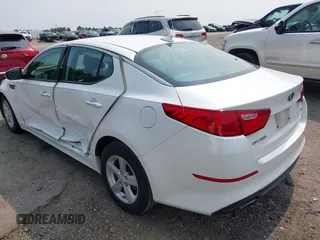 2015 Kia Optima LX z VIN KNAGM4A72F5627037, wystawiony jako IAAI lot #42399339 z przebiegiem 149 612 mil mil oraz . Historia ofert i sprzedaży dostępna na DreamBid. Obrazek 3.