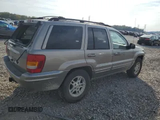 1999 Jeep Grand Cherokee Limited with VIN 1J4G268S7XC668348, listed as a Copart auction lot 77824084 with 165,779 mi miles and Salvage title. Bid and sale history available at DreamBid. Image 3.