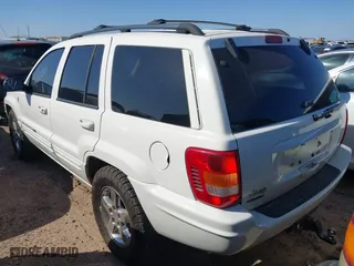 2004 Jeep Grand Cherokee Limited with VIN 1J8GW58N74C380204, listed as a IAAI auction lot 41756657 with 239,697 mi miles. Bid and sale history available at carsss.com. Image 3.