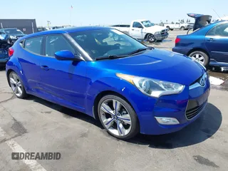 2013 Hyundai Veloster w/Black Int with VIN KMHTC6AD6DU143974, listed as a IAAI auction lot 42164745 with 136,195 mi miles and . Bid and sale history available at DreamBid. Image 1.