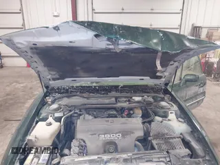 1997 Pontiac Bonneville SE z VIN 1G2HX52KXVH250272, wystawiony jako IAAI lot #41644041 z przebiegiem 160 791 mil mil oraz . Historia ofert i sprzedaży dostępna na DreamBid. Obrazek 10.