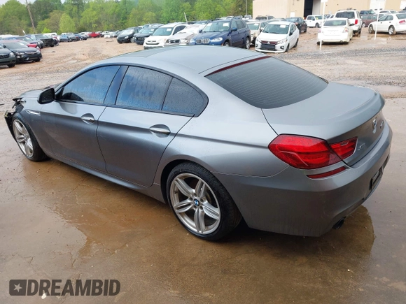 2016 BMW 6 Series 640i xDrive with VIN WBA6D2C58GGT66160, listed as a IAAI auction lot 41130666 with 102,064 mi miles and . Bid and sale history available at carsss.com. Image 3.