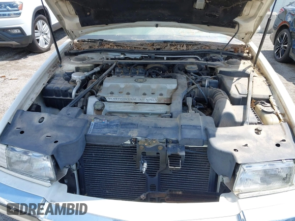 1994 Cadillac Eldorado ESC z VIN 1G6EL12Y4RU604343, wystawiony jako IAAI lot #42221885 z przebiegiem Nie podano mil oraz . Historia ofert i sprzedaży dostępna na DreamBid. Obrazek 10.