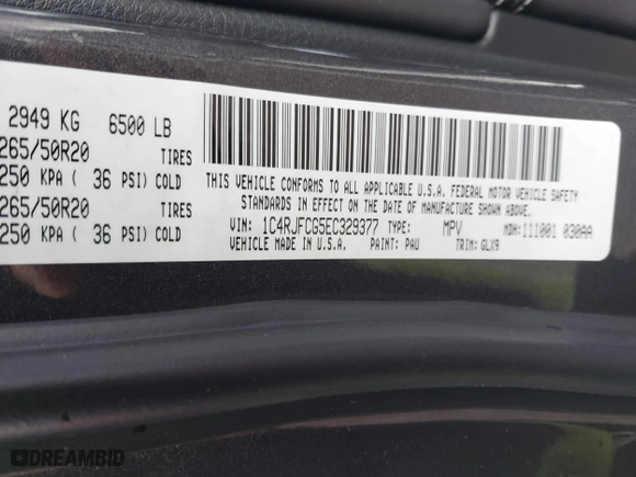 2014 Jeep Grand Cherokee Overland with VIN 1C4RJFCG5EC329377, listed as a IAAI auction lot 40822324 with 106,222 mi miles. Bid and sale history available at carsss.com. Image 9.