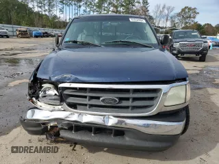 2003 Ford F-150 XL with VIN 1FTRX07273KB66549, listed as a Copart auction lot 83552004 with 205,026 mi miles and Salvage title. Bid and sale history available at DreamBid. Image 5.