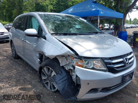 2014 Honda Odyssey Touring with VIN 5FNRL5H97EB054158, listed as a IAAI auction lot 42548360 with 91,161 mi miles and . Bid and sale history available at DreamBid. Image 6.