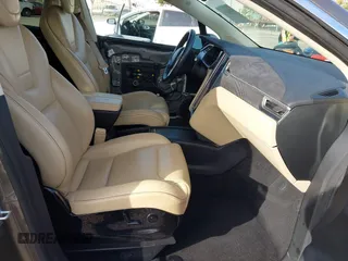 2016 Tesla Model X P90D with VIN 5YJXCAE45GF000773, listed as a IAAI auction lot 42052642 with 127,670 mi miles. Bid and sale history available at carsss.com. Image 5.