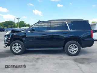 2019 Chevrolet Tahoe LT z VIN 1GNSKBKC1KR200476, wystawiony jako IAAI lot #41897702 z przebiegiem 136 432 mil mil oraz . Historia ofert i sprzedaży dostępna na DreamBid. Obrazek 14.