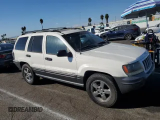 2004 Jeep Grand Cherokee with VIN 1J4GX48JX4C301369, listed as a Copart auction lot 77803094 with 179,404 mi miles and Clean title. Bid and sale history available at DreamBid. Image 4.