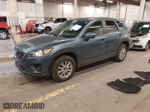 2016 Mazda CX-5 Touring z VIN JM3KE4CY2G0839202, wystawiony jako IAAI lot #41901207 z przebiegiem 65 449 mil mil oraz . Historia ofert i sprzedaży dostępna na DreamBid. Obrazek 2.