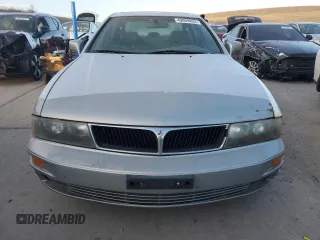 2000 Mitsubishi Diamante LS z VIN 6MMAP67P5YT006608, wystawiony jako Copart lot #49009455 z przebiegiem 241 503 mil mil oraz Tytuł czysty. Historia ofert i sprzedaży dostępna na DreamBid. Obrazek 5.
