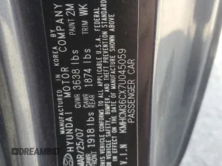 2007 Hyundai Accent GS with VIN KMHCM36CX7U045059, listed as a Copart auction lot 52089115 with 88,166 mi miles and Salvage title. Bid and sale history available at DreamBid. Image 14.