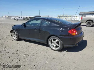 2004 Hyundai Tiburon GT with VIN KMHHN65F94U113699, listed as a Copart auction lot 53858355 with 221,999 mi miles and Salvage Title. Bid and sale history available at carsss.com. Image 2.
