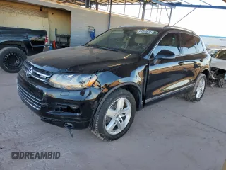 2011 Volkswagen Touareg с VIN WVGFG9BP2BD003056, выставлен на аукционе Copart как лот 84203674 с пробегом 171 456 миль миль и Списание • Salvage title. История ставок и продаж доступна на DreamBid. Изображение 1.