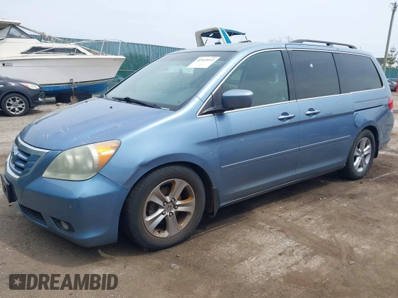 2010 Honda Odyssey Touring with VIN 5FNRL3H93AB008129, listed as a IAAI auction lot 42115112 with 260,075 mi miles. Bid and sale history available at carsss.com. Image 2.