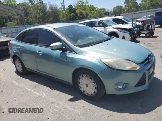 2012 Ford Focus SE with VIN 1FAHP3F29CL428201, listed as a Copart auction lot 52566905 with 209,909 mi miles and Salvage title. Bid and sale history available at DreamBid. Image 4.