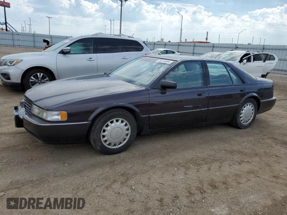 1992 Cadillac Seville z VIN 1G6KY53BXNU804126, wystawiony jako Copart lot #69219394 z przebiegiem 100 647 mil mil oraz Czysty tytuł • Clean title. Historia ofert i sprzedaży dostępna na DreamBid. Obrazek 1.