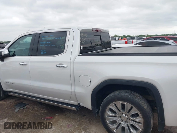 2022 GMC Sierra 1500 Denali with VIN 3GTU9FELXNG127029, listed as a IAAI auction lot 42062882 with 24,082 mi miles and . Bid and sale history available at DreamBid. Image 14.