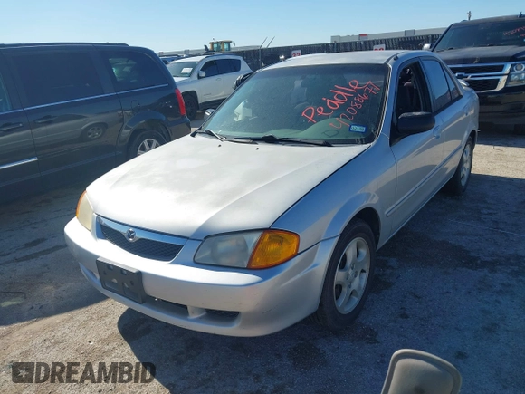 2000 Mazda Protege ES with VIN JM1BJ2213Y0284890, listed as a IAAI auction lot 42088671 with 215,104 mi miles and . Bid and sale history available at DreamBid. Image 2.