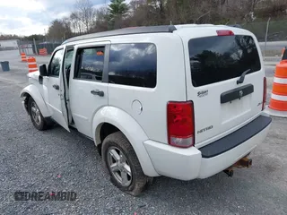 2007 Dodge Nitro SXT with VIN 1D8GU28K77W727391, listed as a IAAI auction lot 41869288 with 214,920 mi miles. Bid and sale history available at carsss.com. Image 3.