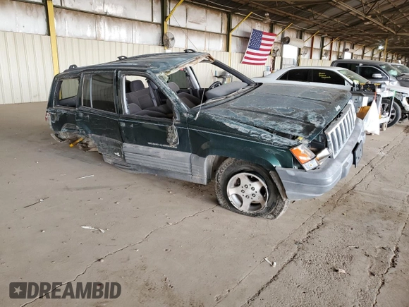 1996 Jeep Grand Cherokee Laredo with VIN 1J4GZ58S6TC304597, listed as a Copart auction lot 52962545 with Not provided miles and Salvage title. Bid and sale history available at DreamBid. Image 4.
