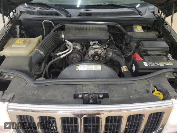 2008 Jeep Commander Sport z VIN 1J8HG48K08C135414, wystawiony jako Copart lot #52410675 z przebiegiem 200 480 mil mil oraz Szkoda całkowita • Salvage title. Historia ofert i sprzedaży dostępna na DreamBid. Obrazek 14.