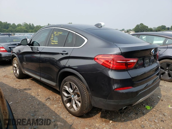 2015 BMW X4 xDrive28i with VIN 5UXXW3C55F0M87998, listed as a Copart auction lot 59693723 with 73,846 mi miles. Bid and sale history available at carsss.com. Image 2.