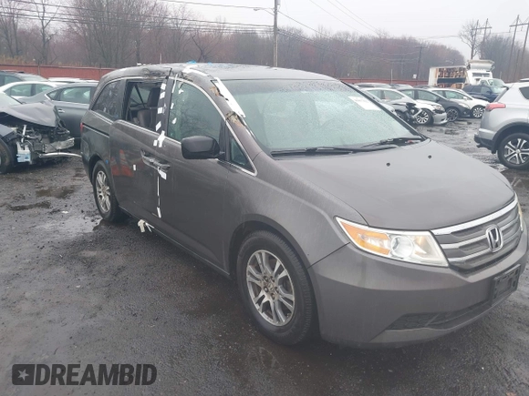 2012 Honda Odyssey EX-L with VIN 5FNRL5H64CB037689, listed as a IAAI auction lot 41857822 with 121,601 mi miles and . Bid and sale history available at carsss.com. Image 6.