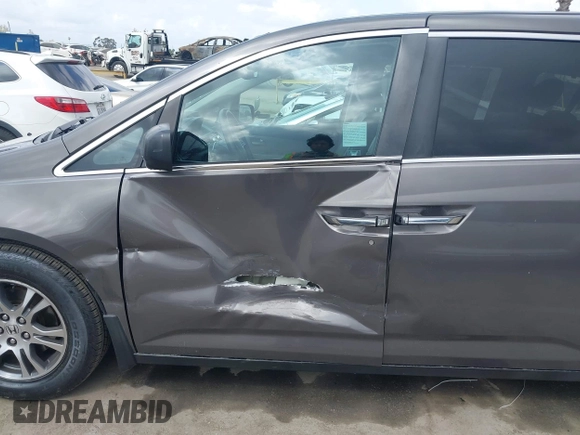 2011 Honda Odyssey EX-L with VIN 5FNRL5H61BB072124, listed as a IAAI auction lot 42115299 with 155,086 mi miles and . Bid and sale history available at DreamBid. Image 6.