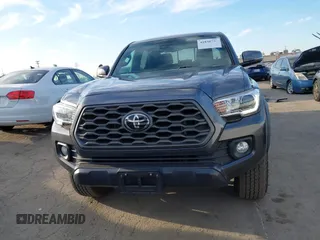 2021 Toyota Tacoma SR5 z VIN 3TMDZ5BN6MM110938, wystawiony jako IAAI lot #41838703 z przebiegiem 67 680 mil mil oraz . Historia ofert i sprzedaży dostępna na DreamBid. Obrazek 12.