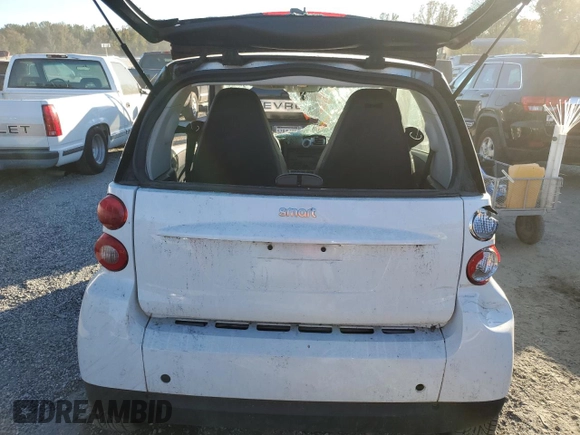 2010 Smart fortwo Pure с VIN WMEEJ3BA4AK363015, выставлен на аукционе Copart как лот 76066204 с пробегом Не указан миль и Списание • Salvage title. История ставок и продаж доступна на DreamBid. Изображение 6.