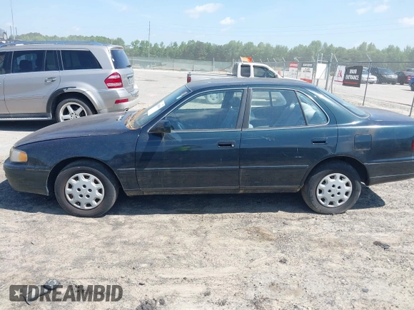 1995 Toyota Camry LE z VIN 4T1SK12E3SU576500, wystawiony jako IAAI lot #42186816 z przebiegiem 216 809 mil mil oraz . Historia ofert i sprzedaży dostępna na DreamBid. Obrazek 13.