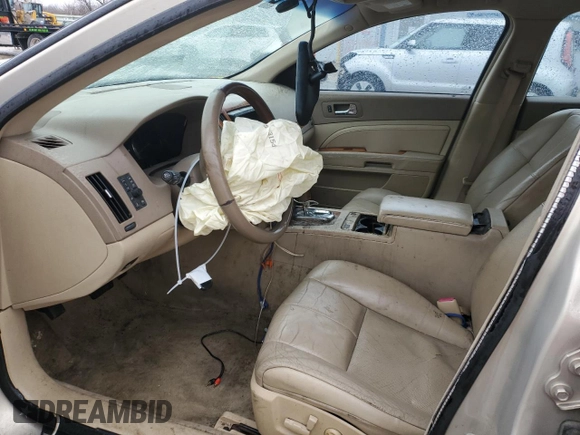 2007 Cadillac STS z VIN 1G6DW677970175897, wystawiony jako Copart lot #43030545 z przebiegiem 158 180 mil mil oraz Szkody całkowita. Historia ofert i sprzedaży dostępna na DreamBid. Obrazek 7.
