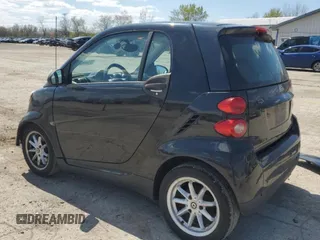 2009 Smart fortwo Pure z VIN WMEEJ31X49K219479, wystawiony jako Copart lot #52446625 z przebiegiem 82 337 mil mil oraz Szkody całkowita. Historia ofert i sprzedaży dostępna na DreamBid. Obrazek 2.