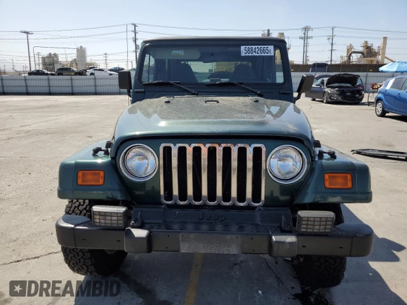 2000 Jeep Wrangler Sahara z VIN 1J4FA59S1YP746043, wystawiony jako Copart lot #58842665 z przebiegiem 148 348 mil mil oraz Szkoda całkowita • Salvage title. Historia ofert i sprzedaży dostępna na DreamBid. Obrazek 5.