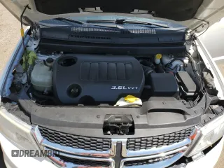 2015 Dodge Journey SXT with VIN 3C4PDCBG5FT628212, listed as a Copart auction lot 60663695 with 145,024 mi miles and Salvage title. Bid and sale history available at DreamBid. Image 11.