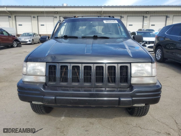 1998 Jeep Grand Cherokee Limited with VIN 1J4GZ78Y0WC140588, listed as a Copart auction lot 49522445 with 62,195 mi miles and Salvage Title. Bid and sale history available at carsss.com. Image 5.