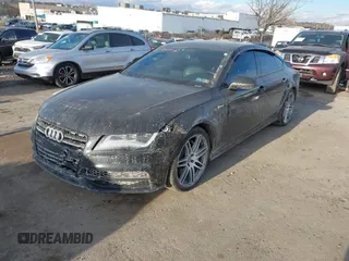 2014 Audi A7 3.0 Prestige with VIN WAU2GAFC6EN030266, listed as a IAAI auction lot 41439486 with 160,917 mi miles. Bid and sale history available at carsss.com. Image 2.