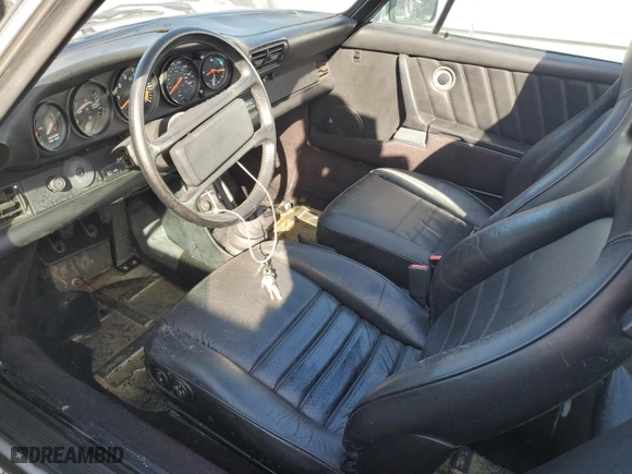 1986 Porsche 911 with VIN WP0EB0917GS161455, listed as a Copart auction lot 74672764 with 80,076 mi miles and Salvage Title. Bid and sale history available at carsss.com. Image 7.
