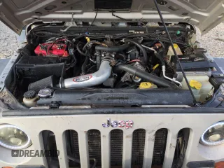 2007 Jeep Wrangler Rubicon z VIN 1J8GA64157L125319, wystawiony jako Copart lot #82929184 z przebiegiem 82 019 mil mil oraz Szkoda całkowita • Salvage title. Historia ofert i sprzedaży dostępna na DreamBid. Obrazek 11.
