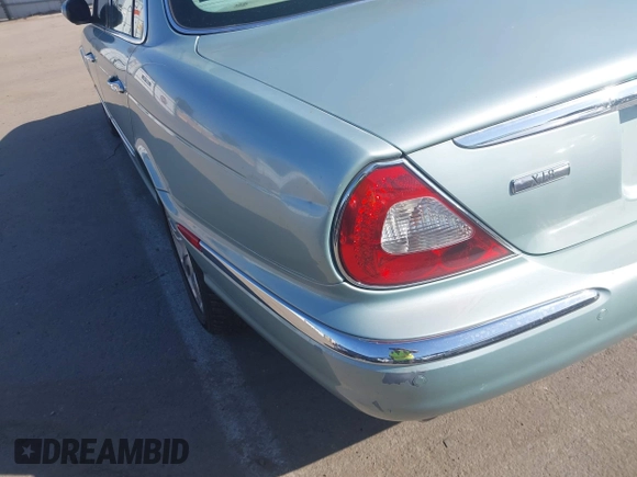 2004 Jaguar XJ 8 with VIN SAJEA71CX4SG10751, listed as a IAAI auction lot 42149348 with 89,786 mi miles and . Bid and sale history available at DreamBid. Image 6.