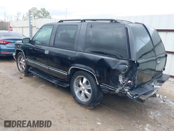 1998 GMC Yukon with VIN 1GKEC13R8WJ711255, listed as a IAAI auction lot 41457304 with 291,211 mi miles. Bid and sale history available at carsss.com. Image 3.