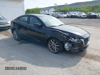 2017 Mazda 3 Touring z VIN 3MZBN1V74HM133565, wystawiony jako IAAI lot #42160836 z przebiegiem 104 997 mil mil oraz . Historia ofert i sprzedaży dostępna na DreamBid. Obrazek 1.