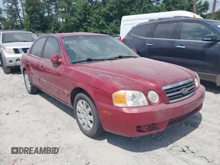 2004 Kia Optima LX z VIN KNAGD126345254527, wystawiony jako IAAI lot #42453982 z przebiegiem Nie podano mil oraz . Historia ofert i sprzedaży dostępna na DreamBid. Obrazek 1.