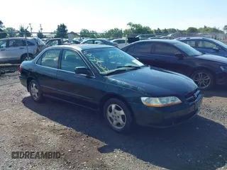 1998 Honda Accord EX with VIN 1HGCG5654WA267042, listed as a IAAI auction lot 42755022 with 266,986 mi miles and . Bid and sale history available at DreamBid. Image 1.