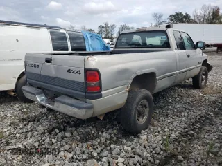 1999 Dodge Ram 2500 with VIN 1B7KF2363XJ519664, listed as a Copart auction lot 79477244 with 415,712 mi miles and Salvage Title. Bid and sale history available at carsss.com. Image 3.
