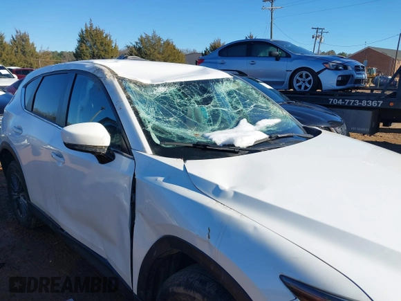 2020 Mazda CX-5 Touring with VIN JM3KFBCM0L0828207, listed as a IAAI auction lot 41305801 with 56,500 mi miles and . Bid and sale history available at DreamBid. Image 6.